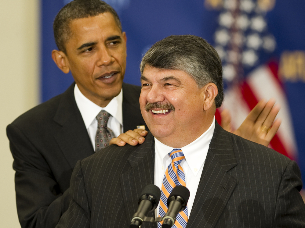 President Obama pats AFL-CIO President Richard Trumka on the back before speaking at the AFL-CIO Executive Council Meeting in Washington last August. Trumka said recently that unions need to start demanding accountability from their allies.