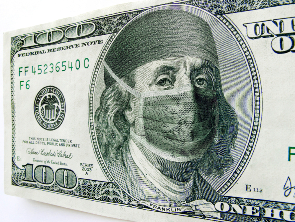 Ben Franklin wears a surgical mask on a $100 bill.