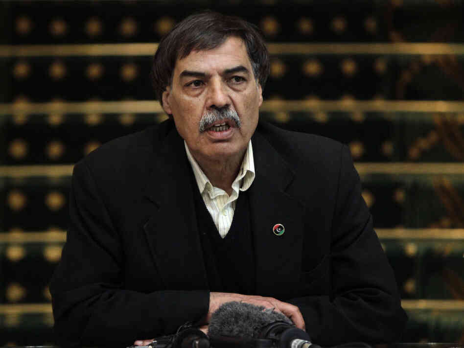 On April 1, Ali Tarhouni tells the media in Benghazi that Qatar agreed to give the rebels money for weapons and other items in exchange for the oil they control. On April 1, Ali Tarhouni tells the media in Benghazi that Qatar agreed to give the rebels money for weapons and other items in exchange for the oil they control.