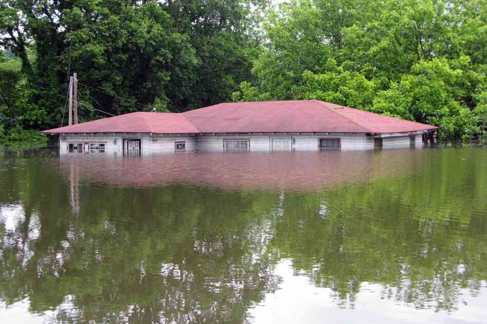 MAY 15: The flooding in Vicksburg, Miss. has put many houses underwater. Only the roofs are visible on others, like this one. 