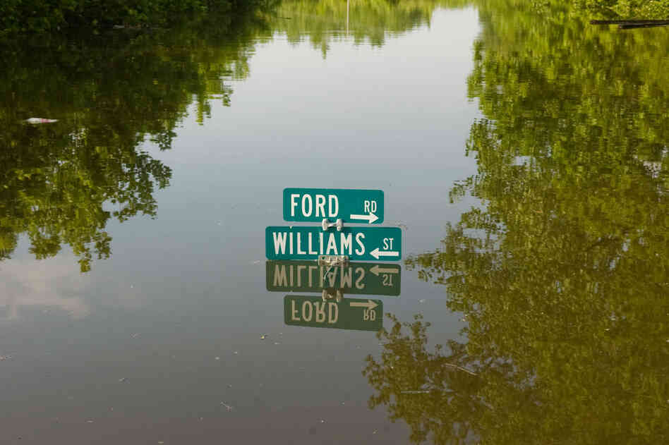 MAY 9: A street sign in the Ford subdivision is nearly submerged  in Vicksburg. 