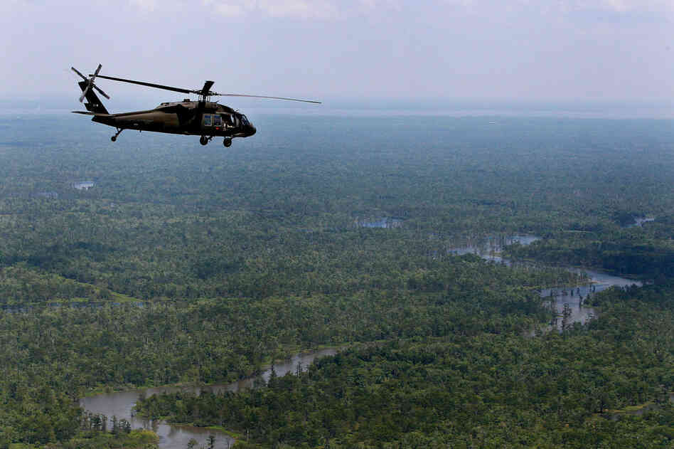 MAY 12: A Black Hawk helicopter carrying Louisiana Gov. Bobby Jindal flies over the Atchafalaya Basin in Louisiana during a tour of areas that may be affected by flooding if the Morganza Spillway north of Baton Rouge is opened. 