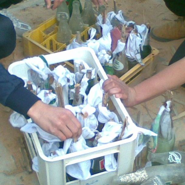 A group of Libyans make Molotov cocktails in Tripoli.