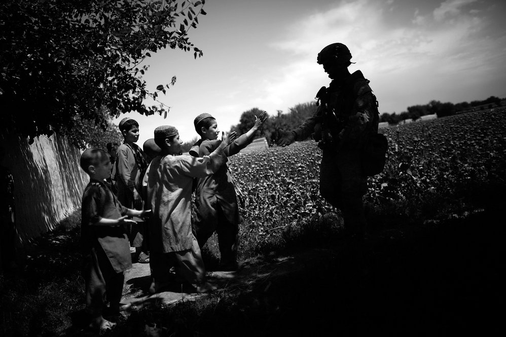 For Marines, the mission is to secure the local population. An upside to the lull in fighting is increased interaction with Afghans. Children become accustomed to seeing Marines, and have even adopted some gestures, such as fist-bumping.