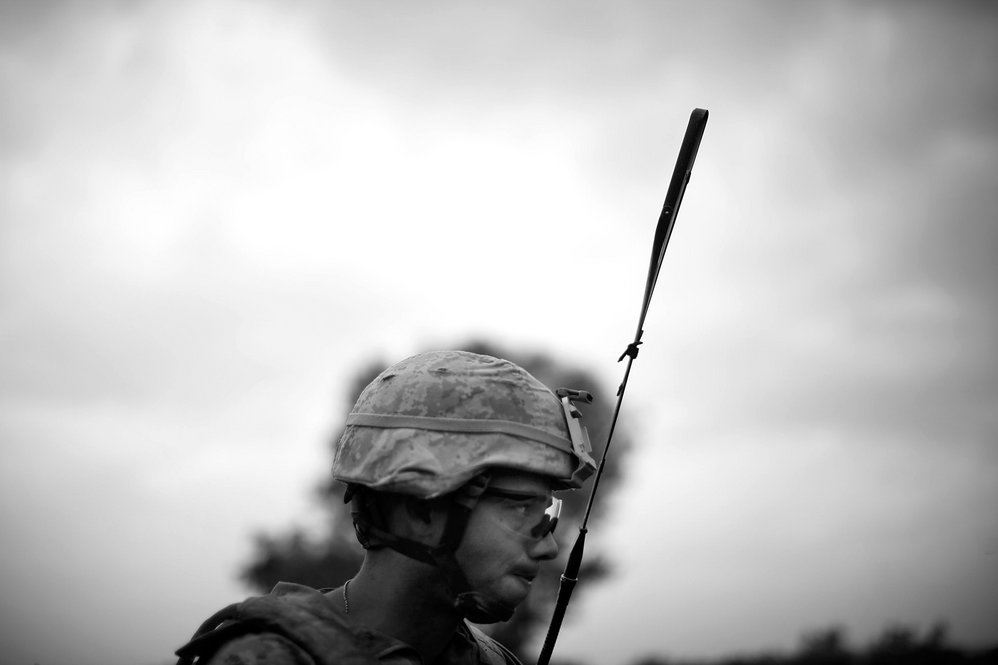 Sgt. David Leon looks over a poppy field. Insurgent sniper teams that typically work the area shoot from hiding spots known as "murder holes."