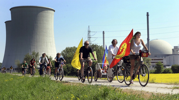 Protesters ride their bikes and hold flags reading "Nuclear power? No thanks" during a demonstration at the nuclear power plant of Biblis in Germany on April 25. Germany canceled plans to build new plants in the aftermath of the nuclear disaster in Japan.