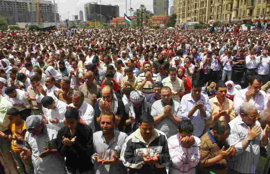 Egyptians say Friday prayers at a rally in Cairo's Tahrir Square on Friday. The rally called for national unity after attacks on Egyptian churches.