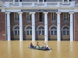 City workers transported a load of sandbags past the Yazoo & Mississippi Valley Railroad Station to help reinforce a levee gate in Vicksburg, Miss. City workers transported a load of sandbags past the Yazoo & Mississippi Valley Railroad Station to help reinforce a levee gate in Vicksburg, Miss.