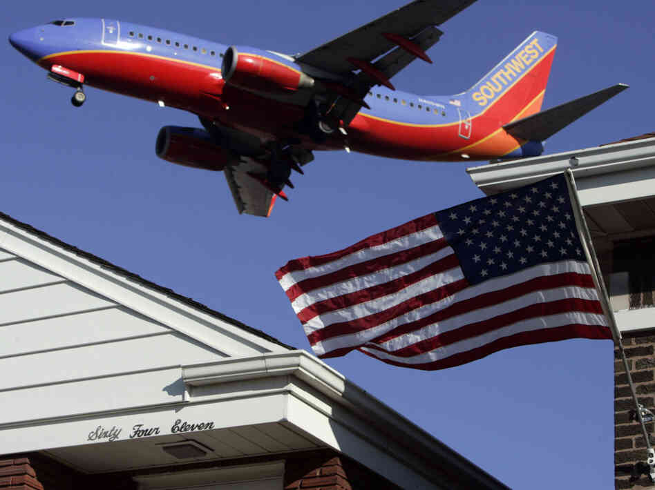 A plane flies over a Chicago neighborhood as it lands at Midway Airport. A recent World Health Organization study reports noise pollution can be a health threat.
