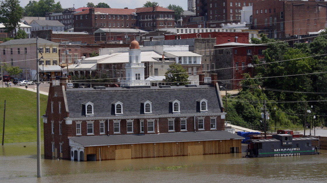 Mississippi floodwaters creep up the Old Train Depot and flood walls of downtown Vicksburg, Miss., on Friday.