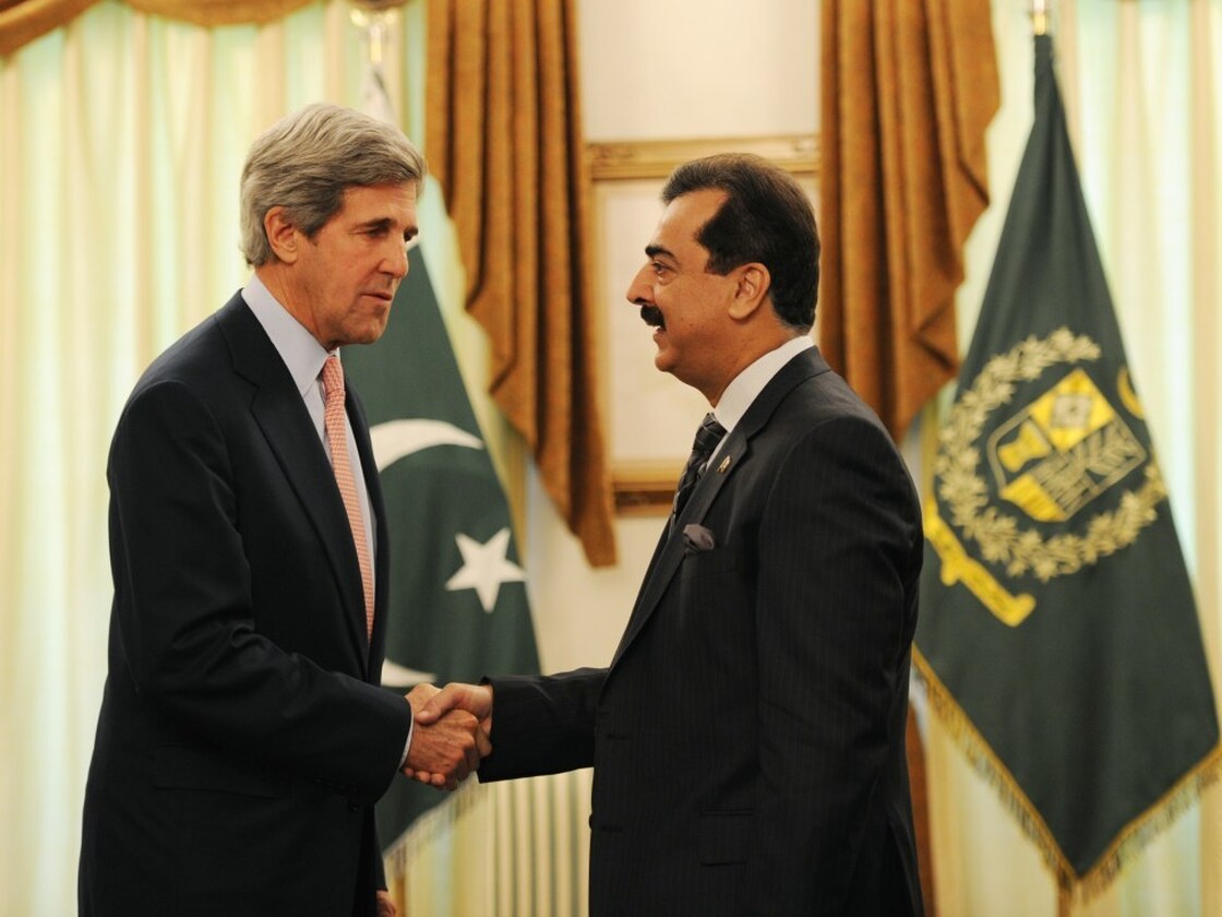 U.S. Sen. John Kerry (left) shakes hands with Pakistani Prime Minister Yousuf Raza Gilani during a meeting in Islamabad on Monday.