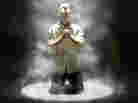 Male looks up in prayer.