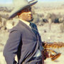 William Claxton's cover photo of Sonny Rollins standing in the desert — sporting a cowboy hat, gun holster and humorously knowing look — has only added to Way Out West's classic status. William Claxton's cover photo of Sonny Rollins standing in the desert — sporting a cowboy hat, gun holster and humorously knowing look — has only added to Way Out West's classic status.