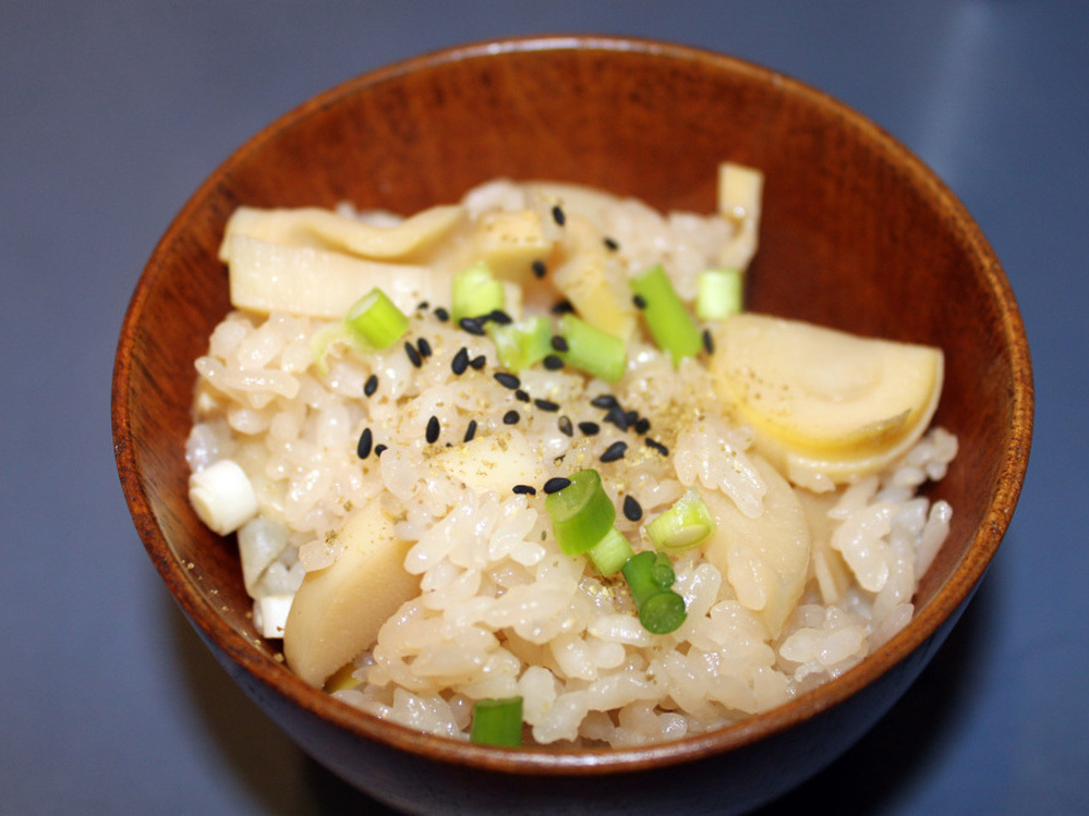 Japanese ex-pats are especially nostalgic for the popular dish of Steamed Rice with Bamboo Shoots (Takenoko Gohan), accented here with ground sansho pepper and black sesame seeds.