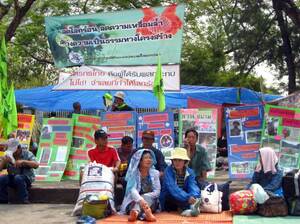 Urban and rural poor from Thailand protest outside government offices in Bangkok. Activists working for slum dwellers have made it harder for developers to obtain land in Thailand without first agreeing with residents on compensation. Urban and rural poor from Thailand protest outside government offices in Bangkok. Activists working for slum dwellers have made it harder for developers to obtain land in Thailand without first agreeing with residents on compensation.