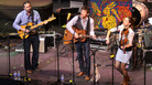 From left, Greg Glassman, David Wax and Suz Slezak perform on Mountain Stage. From left, Greg Glassman, David Wax and Suz Slezak perform on Mountain Stage.