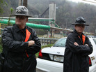Two officers with the Raleigh County Sheriff's Office stand guard in front of the Upper Big Branch coal mine several days after the April 5, 2010, explosion that killed 29 workers in Montcoal, W.Va. Two officers with the Raleigh County Sheriff's Office stand guard in front of the Upper Big Branch coal mine several days after the April 5, 2010, explosion that killed 29 workers in Montcoal, W.Va.