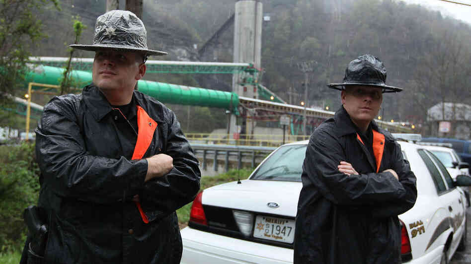 Two officers with the Raleigh County Sheriff's Office stand guard in front of the Upper Big Branch coal mine several days after the April 5, 2010, explosion that killed 29 workers in Montcoal, W.Va. Two officers with the Raleigh County Sheriff's Office stand guard in front of the Upper Big Branch coal mine several days after the April 5, 2010, explosion that killed 29 workers in Montcoal, W.Va.