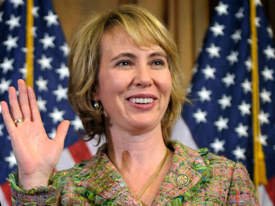 In this Jan. 5, 2011 file photo, Rep. Gabrielle Giffords,  D-Ariz., takes part in a reenactment of her swearing-in, on Capitol  Hill in Washington.