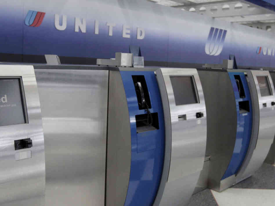 A United Airlines check-in counter at O'Hare International Airport A United Airlines check-in counter at O'Hare International Airport