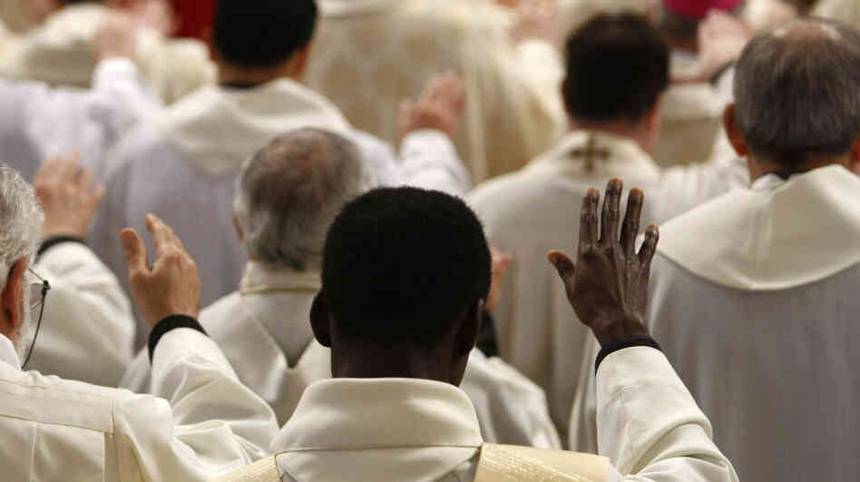 Priests follow a Mass at the Vatican. The clergy sex abuse scandal that erupted in Boston in 2002 has cost U.S. dioceses nearly $3 billion and has spread to Europe and beyond.