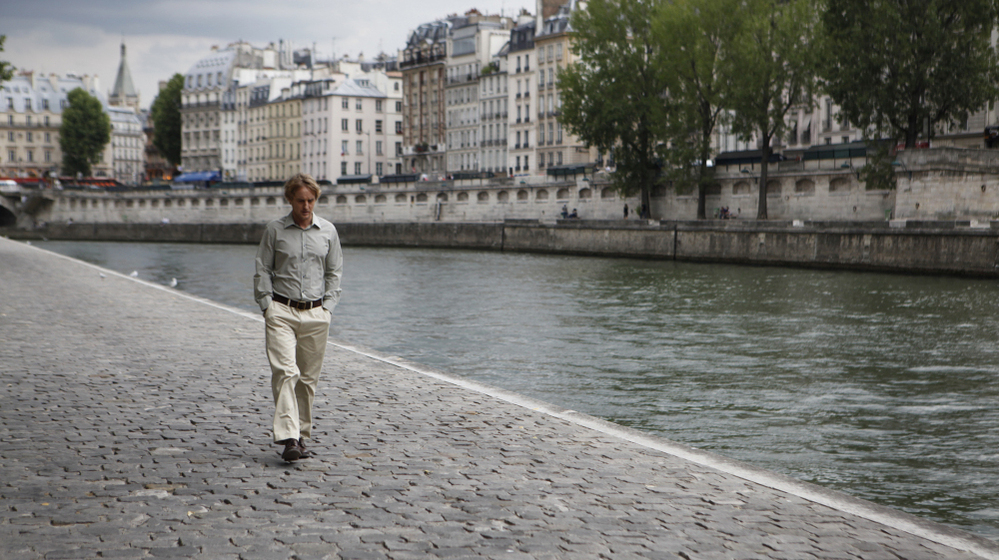 Owen Wilson plays Gil, a Hollywood screenwriter on vacation in Paris who wishes he could escape back to the 1920s. David Edelstein says his performance is one of the finest by a lead in a Woody Allen film — and rivals many of Allen's performances, too. Owen Wilson plays Gil, a Hollywood screenwriter on vacation in Paris who wishes he could escape back to the 1920s. David Edelstein says his performance is one of the finest by a lead in a Woody Allen film — and rivals many of Allen's performances, too.