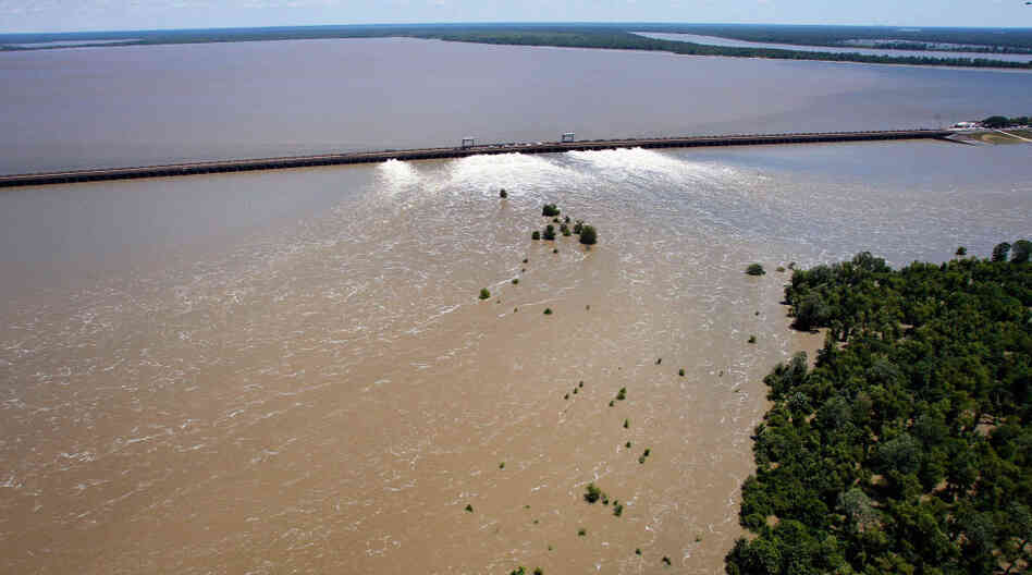 Water from the Mississippi River rushes out of open bays on the Morganza Spillway and into a  pasture in Morganza, La., on Monday, May 16, 2011.