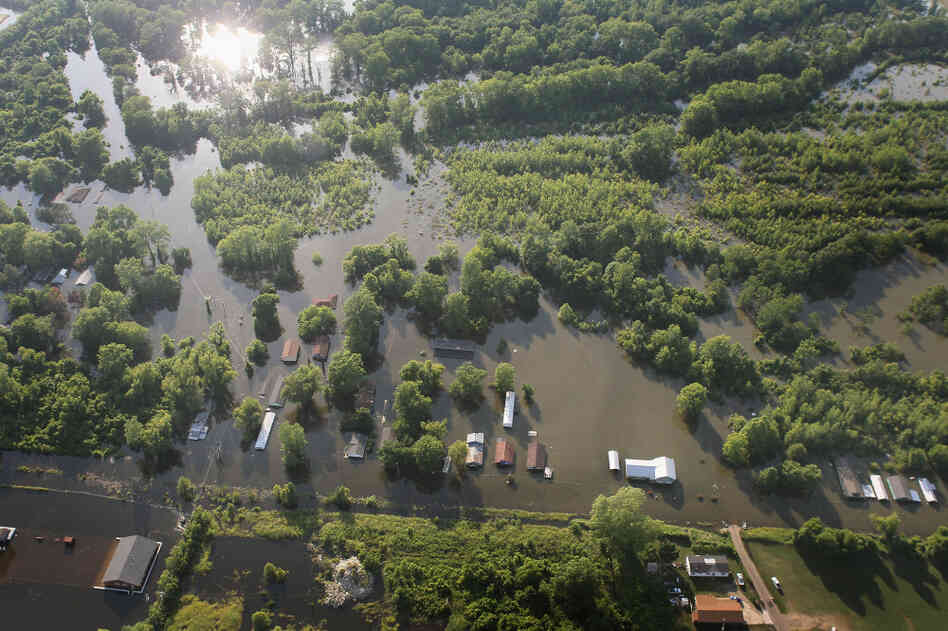 Floodwaters inundate homes in Vicksburg, Miss., on Wednesday. Floodwaters inundate homes in Vicksburg, Miss., on Wednesday.