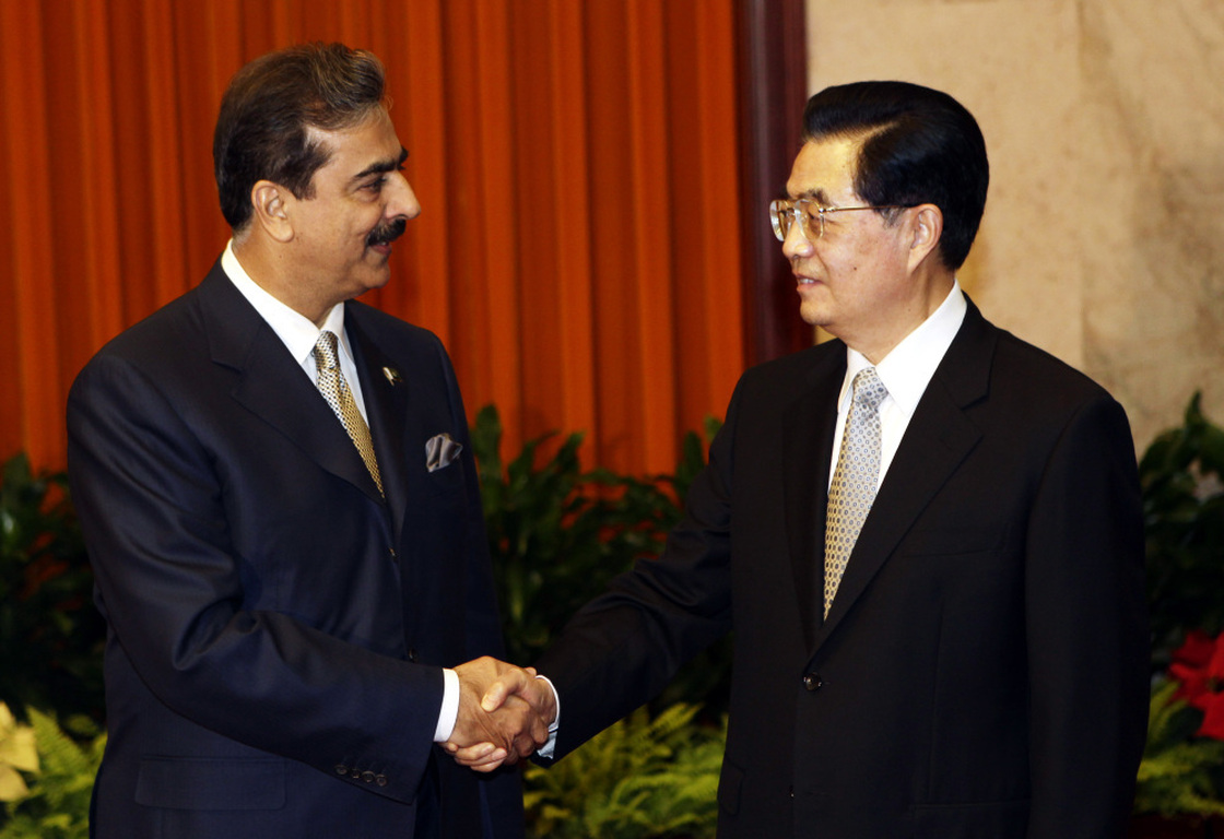 Pakistan's Prime Minister Yusuf Raza Gilani (L) shakes hands with China's President Hu Jintao during a meeting at the Great Hall of the People in Beijing, May 20.