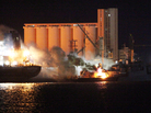 Fire engulfs a boat in Tripoli after NATO aircraft bombed eight vessels on May 20, 2011. This photo was taken during a Libyan government guided tour. Fire engulfs a boat in Tripoli after NATO aircraft bombed eight vessels on May 20, 2011. This photo was taken during a Libyan government guided tour.