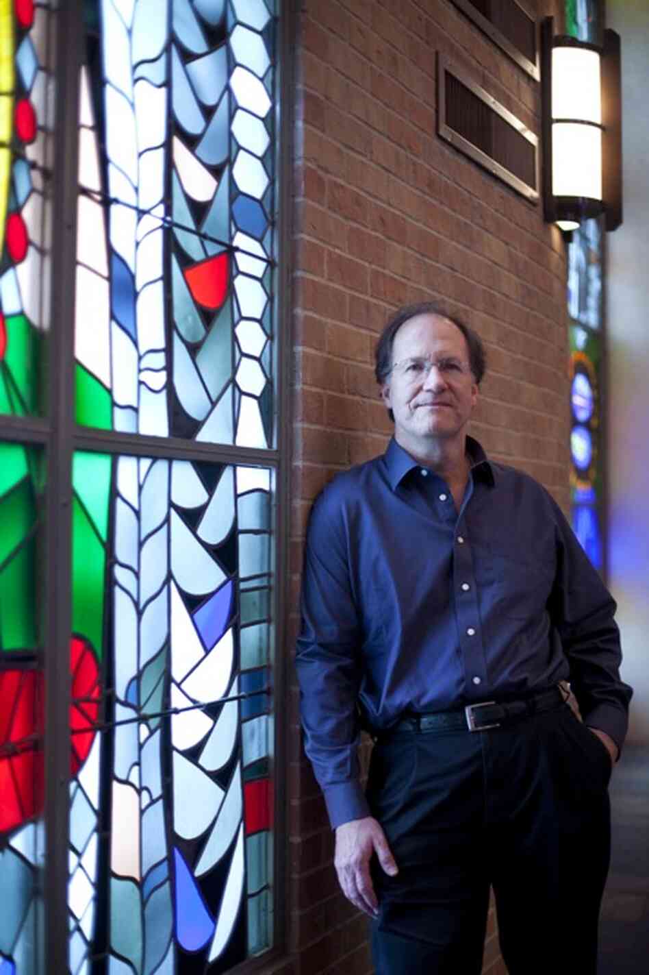 Robert Kyr poses in St. Martin's Lutheran Church in Austin, Texas.  Kyr, the composer-in-residence for the concert series  "Renaissance and Response", created original music for the concerts.  Kyr's compositions were performed by the choral group Conspirare. 