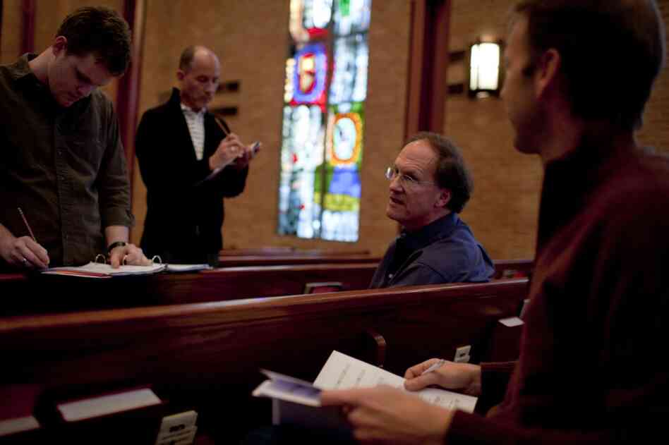 Robert Kyr (third from left), composer-in-residence for the choral group Conspirare, works with musicians and singers (from left) Greg Luce, Stephen Redfield and Greg Sauer during rehearsal for the concert series "Renaissance and Response".