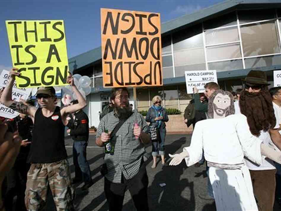 Evangelist Harold Camping's failed prediction that the world would end May 21 prompted humorous protests like this one Saturday outside the Oakland, Calif., offices of his Family Radio. But it's too soon to tell how Camping's followers will cope with the failed prophecy. Evangelist Harold Camping's failed prediction that the world would end May 21 prompted humorous protests like this one Saturday outside the Oakland, Calif., offices of his Family Radio. But it's too soon to tell how Camping's followers will cope with the failed prophecy.