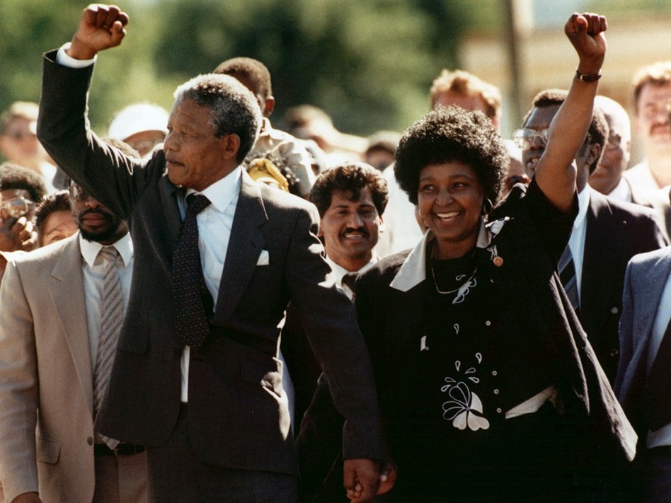 Mandela and his wife Winnie greet the crowd upon his release from Victor prison in Cape Town on Feb. 11, 1990 after serving 27 years in jail.