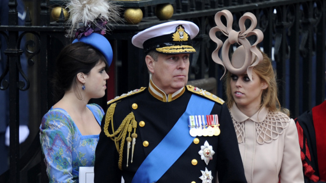 Prince Andrew, The Duke of York (C) and his daugthers Princesses Eugenie (L) and Beatrice  leave Westminster Abbey in London, after the wedding service, on April 29, 2011.