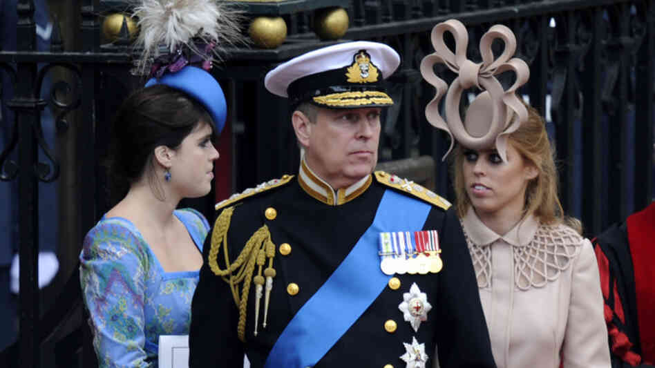 Prince Andrew, The Duke of York (C) and his daugthers Princesses Eugenie (L) and Beatrice  leave Westminster Abbey in London, after the wedding service, on April 29, 2011.