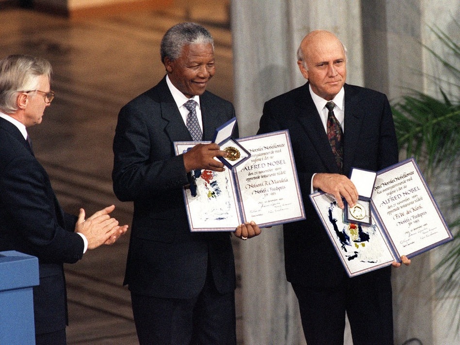 Mandela and South African President Frederik de Klerk (right) display their Nobel Prizes on Dec 9,1993 in Oslo, Norway after being awarded jointly for their work to end apartheid peacefully.