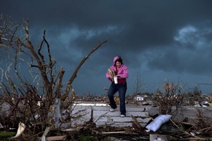 Janet Martin attempts to salvage items from her brother's home in Joplin. "Twenty minutes before the storm, he left to go to church. He would have been in that basement if he hadn't gone," Martin said.