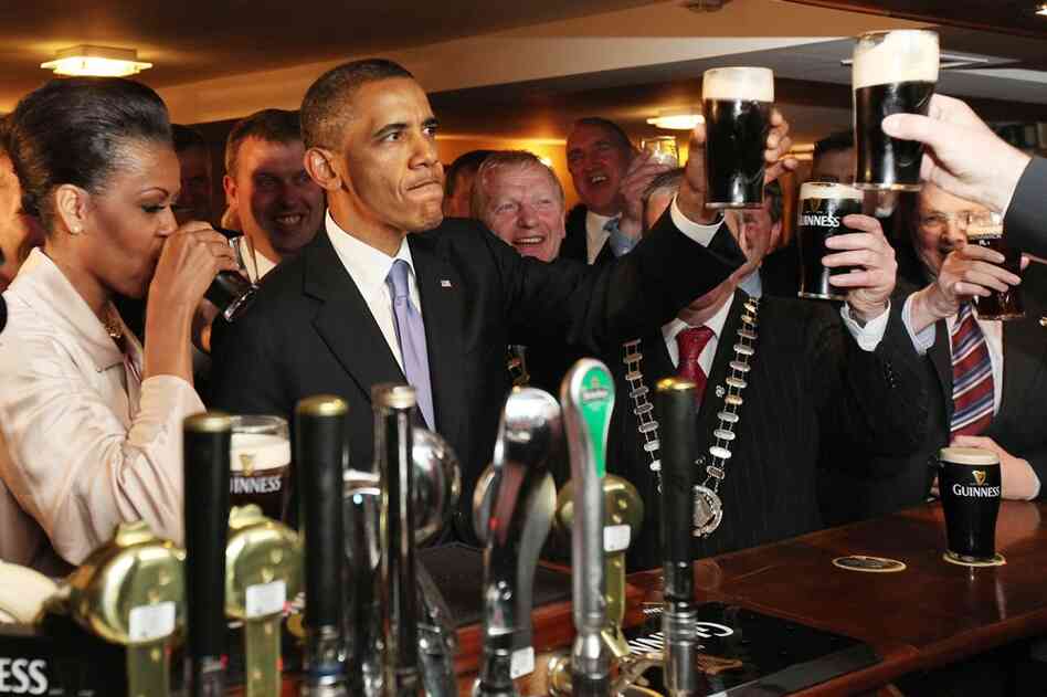 President Obama and first lady Michelle Obama sample a glass of Guinness on Monday in Moneygall, Ireland. 