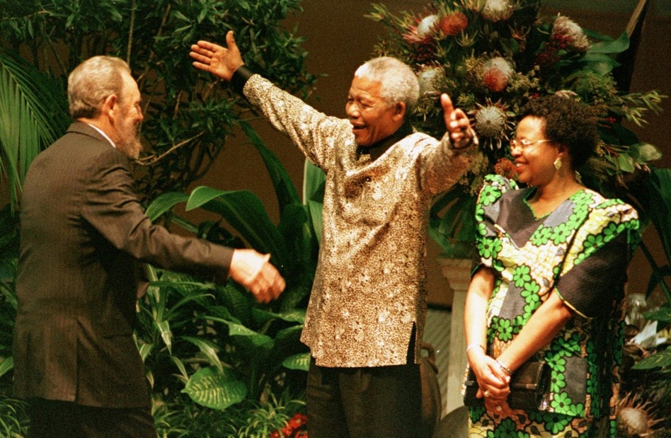 Mandela and his second wife, Graca Machel, greet Cuban President Fidel Castro, left, at the 12th Non-Aligned Movement Summit meeting, Sept. 2, 1998.