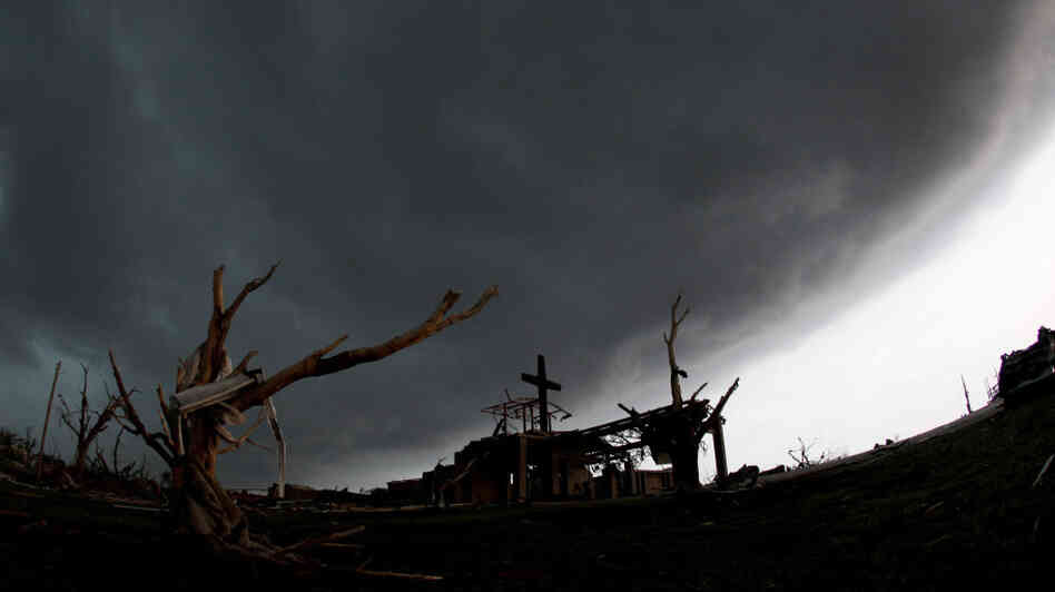 A cross stood atop a church that was severely damaged by a tornado Sunday in Joplin, Mo., as a severe storm passed overhead earlier today (May 23, 2011).