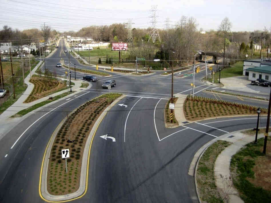 Cities like Charlotte, N.C., are moving to improve roadways for pedestrians and cyclists. Above, a street project on Rozzelles Ferry Road, which now has bike lanes and extended sidewalks. Below, an aerial photo of the intersection before work began.