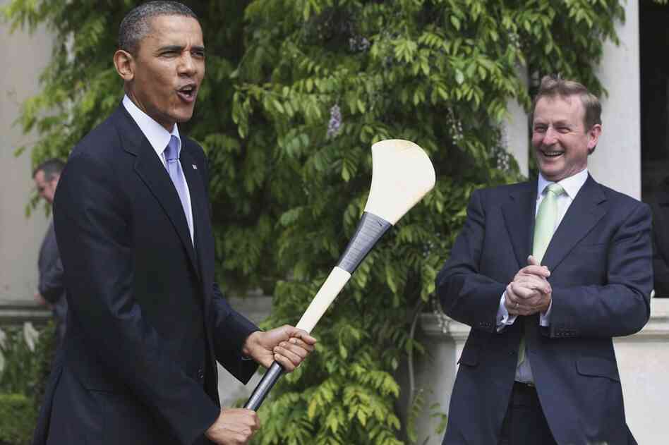 Irish Prime Minister Enda Kenny presents Obama with a hurley stick — used in the Irish national sport of hurling — while at Farmleigh, Dublin.