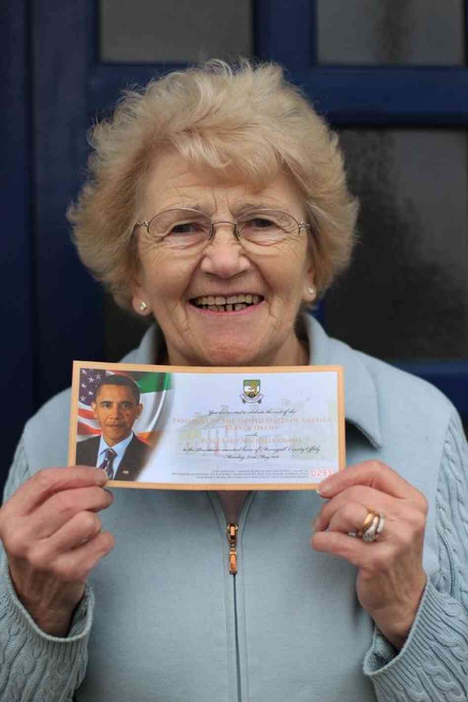 Moneygall resident Maura Slater poses with her official ticket to see Obama during his visit. 