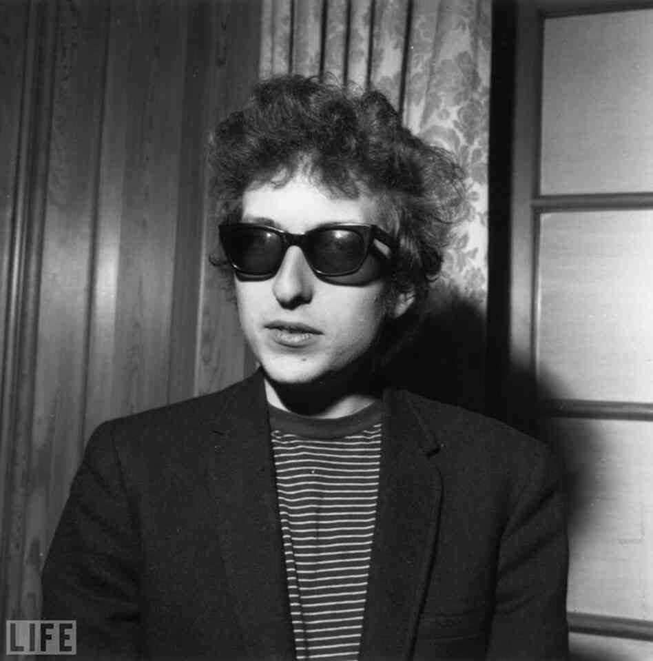 Dylan sports shades in London in April 1965. In March of that year he had made his first move toward electric instruments when he released "Subterranean Homesick Blues." 