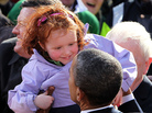 President Obama admires an Irish toddler to the delight of the crowd. President Obama admires an Irish toddler to the delight of the crowd.
