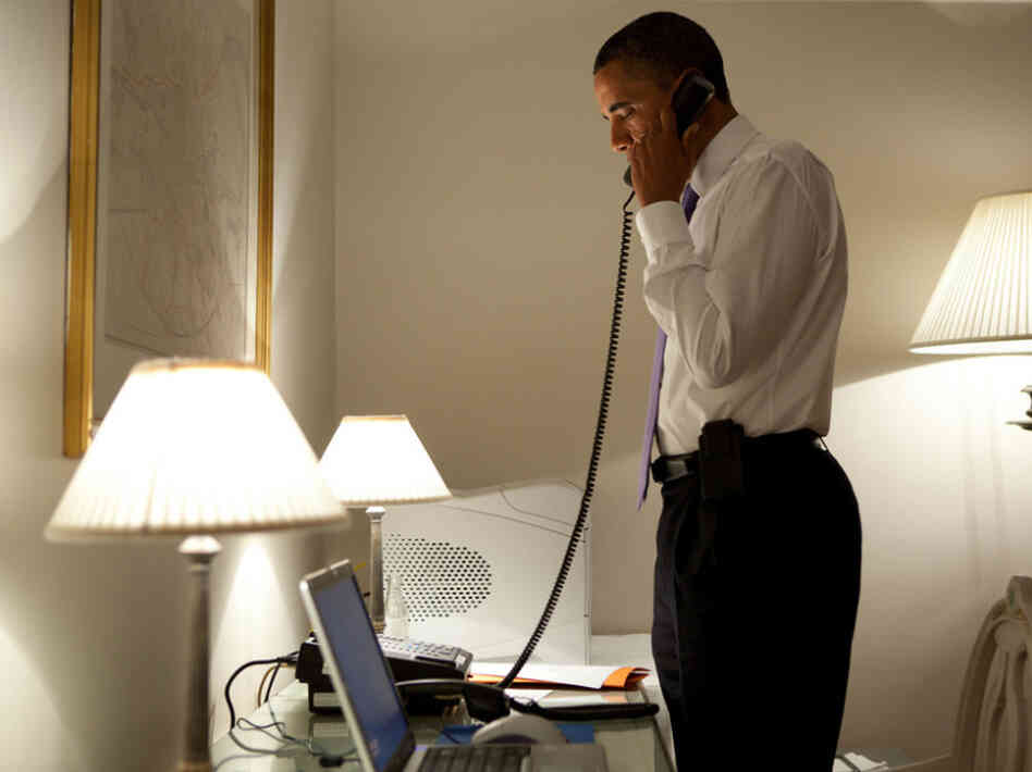 President Obama talks on the phone with Missouri Gov. Jay Nixon, during his visit to Dublin on Monday.