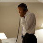 President Obama talks on the phone with Missouri Gov. Jay Nixon, during his visit to Dublin on Monday.