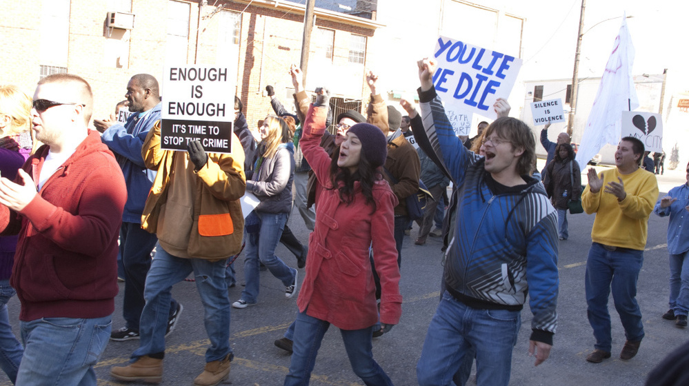 Annie (Lucia Micarelli) and Davis (Steve Zahn) march in the recreation of the Silence is Violence parade in Jan. 2007.