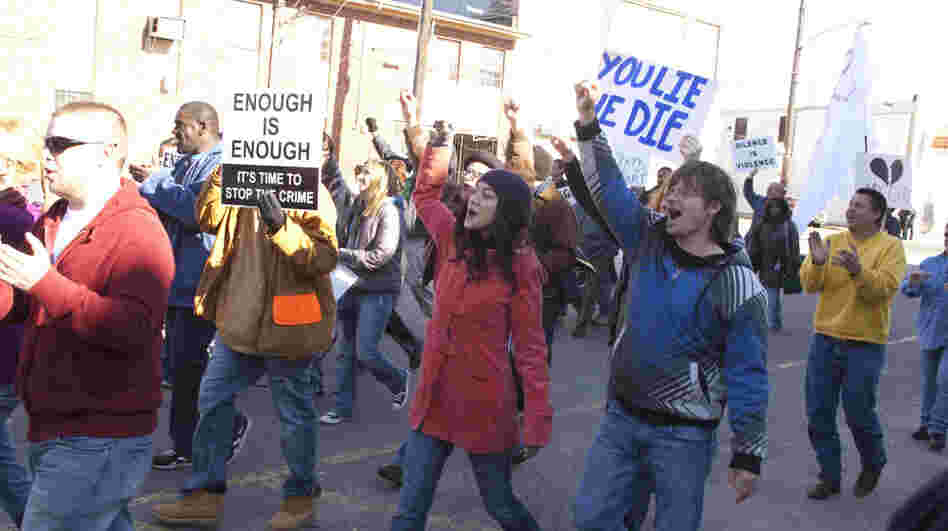 Annie (Lucia Micarelli) and Davis (Steve Zahn) march in the recreation of the Silence is Violence parade in Jan. 2007.